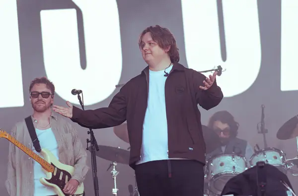 Lewis Capaldi with his arms out to the crowd, Pyramid Stage, Glastonbury, June 27, 2025