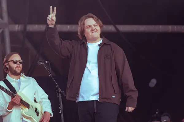 Lewis Capaldi raising a peace sign at the start of his return set, Pyramid Stage, Glastonbury, June 27, 2025