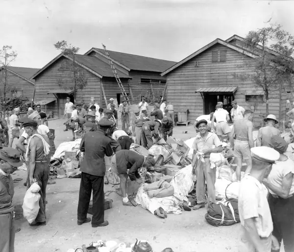 Allied prisoners gathering air-dropped supplies at the Omori camp, Tokyo, August 30, 1945