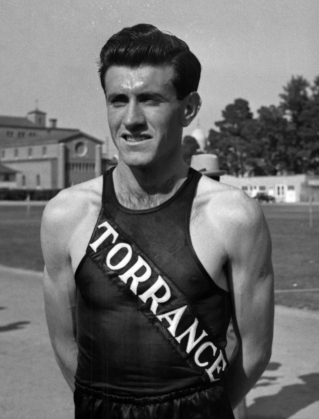 Louis Zamperini on Bovard Field at USC, in his Torrance High School track uniform, June 7, 1938
