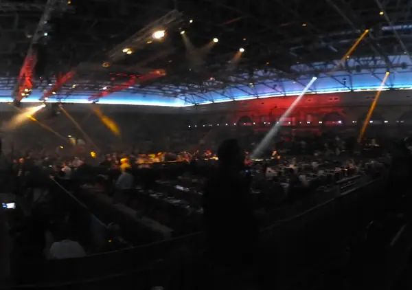 The darkened darts hall at Alexandra Palace during the 2016 World Championship, January 2, 2016 (cropped; not 2024–26)