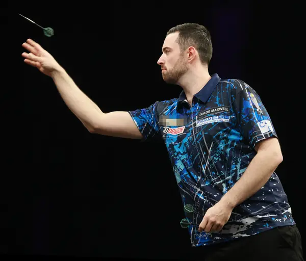 Luke Humphries throwing at a Premier League Darts night, Berlin, April 3, 2025 (cropped; logo pixelated; not the 2024 world final)