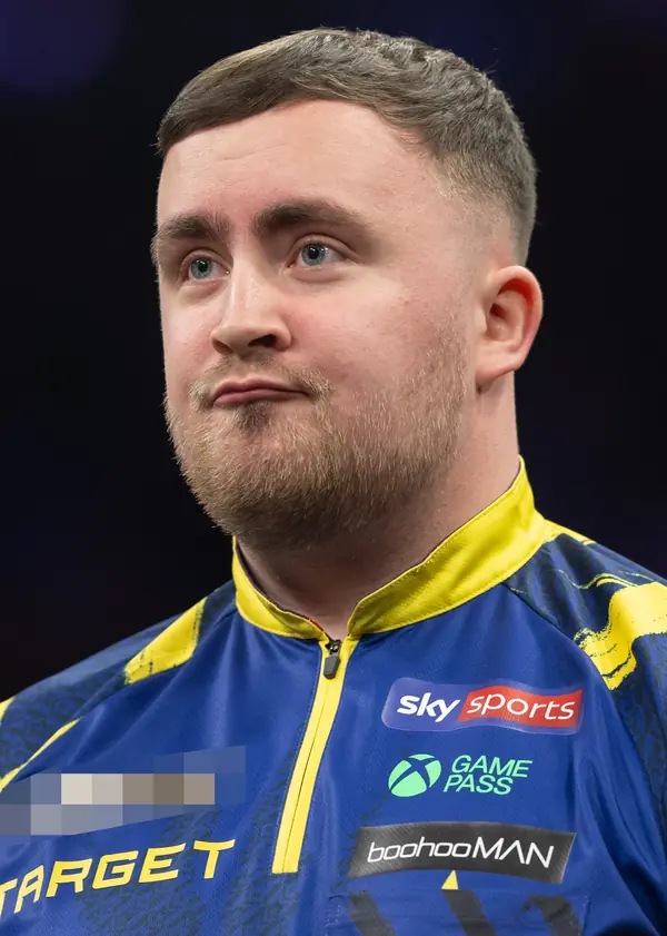 Luke Littler at a Premier League Darts night, Uber Arena, Berlin, March 26, 2026 (cropped; logo pixelated; not a World Championship)