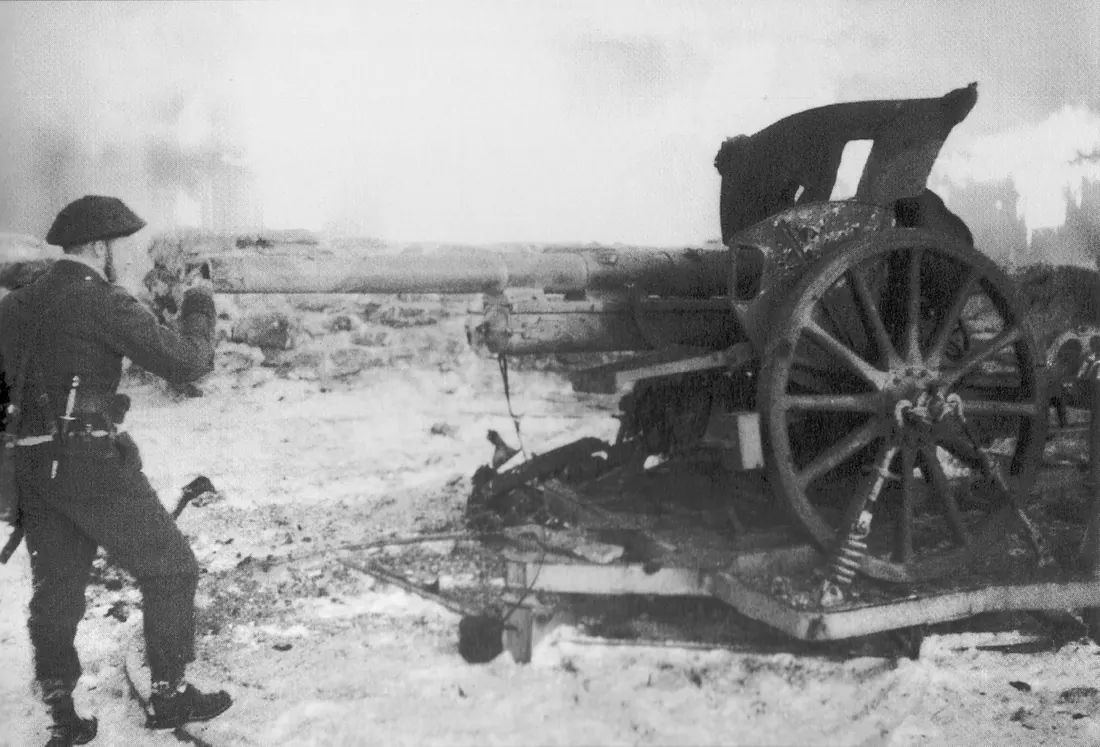 Maj. Jack Churchill examines one of four captured Belgian 75 guns (War Office photograph)