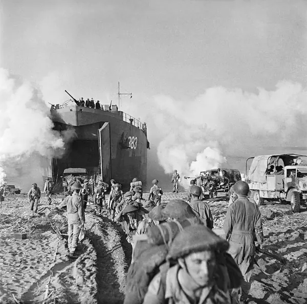 British troops and vehicles of the 46th Division unloaded from LST 383 at Salerno, September 9, 1943