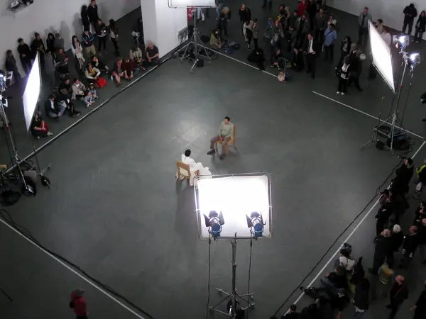 The Artist Is Present from above: Marina Abramović in white, a sitter and the crowd in MoMA’s atrium, May 9, 2010 (not the opening night)