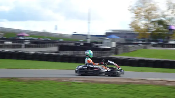 A karter in a green helmet at Kart Silverstone, October 22, 2026 (not Max Verstappen)