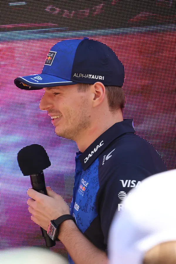 Max Verstappen in profile with a microphone at the Red Bull fan zone, Melbourne, March 5, 2026 (not the race)