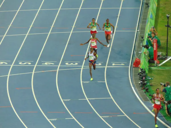Mo Farah crossing the finish line ahead of Paul Tanui, 10,000-meter final, Rio de Janeiro, August 13, 2016