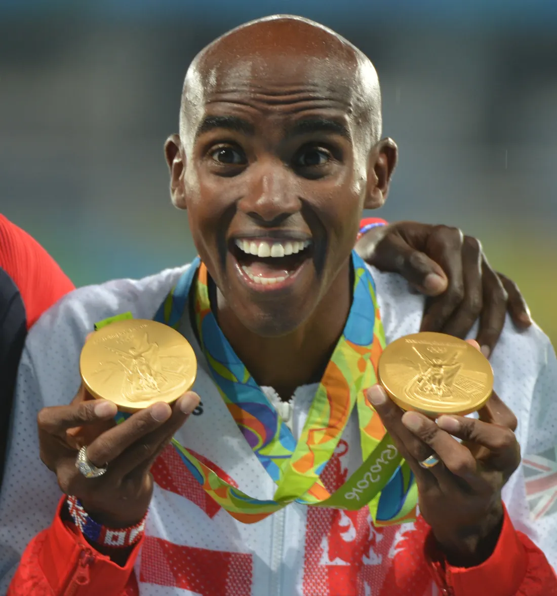 Mo Farah with his two Rio gold medals at the 5,000-meter medal ceremony, Rio de Janeiro, August 2016