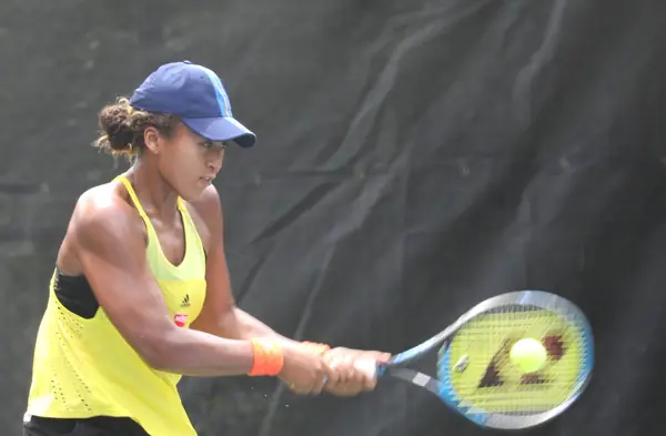 Naomi Osaka hitting a backhand at the 2018 Citi Open, Washington, July 29, 2018 (not the US Open)