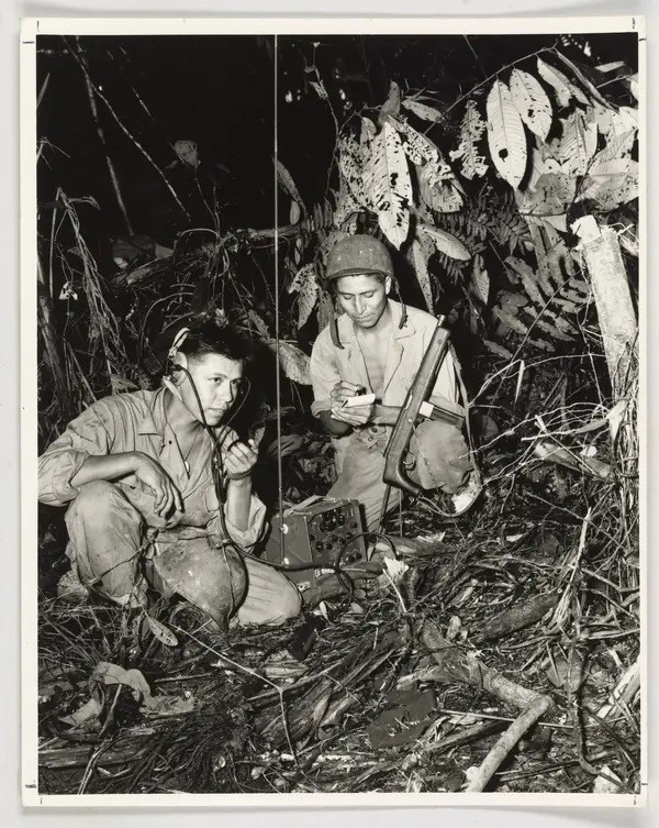 Cpl. Henry Bake Jr. (left) and Pfc. George H. Kirk, Navajos serving with a Marine signal unit, Bougainville, December 1943
