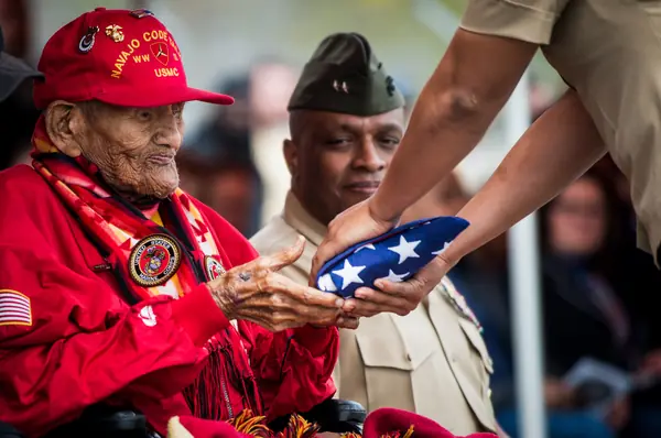 Chester Nez, the last of the original 29 code talkers, receives a flag at Quantico, April 4, 2014