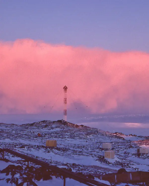 A katabatic snow cloud approaching Dumont d’Urville station, Adélie Land, Antarctica, 1977 (cropped; not Atka Bay)