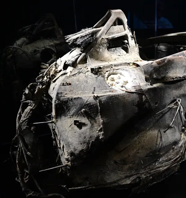 The burned cockpit and halo of his Haas from the side, The Formula 1 Exhibition, London, February 20, 2025 (cropped)