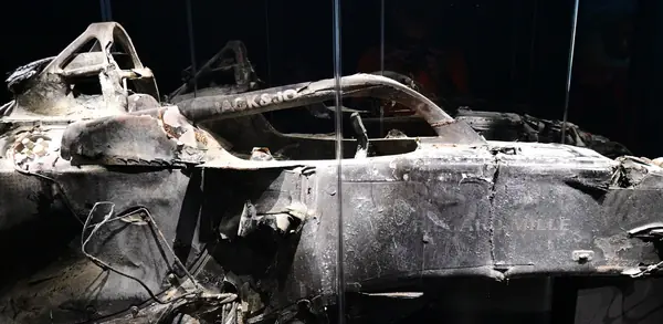 The burned car on show at The Formula 1 Exhibition, London, February 20, 2025 (cropped)