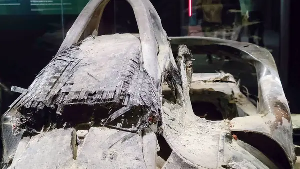 The torn, burned survival cell of his Haas VF-20 at The Formula 1 Exhibition, Madrid, April 13, 2023