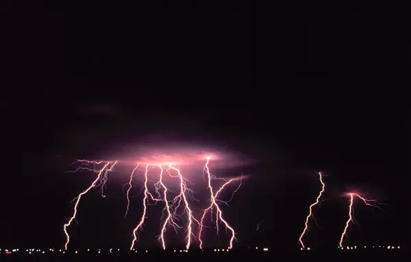 Several cloud-to-ground lightning strokes in one time-lapse photo, Norman, Oklahoma, 1978