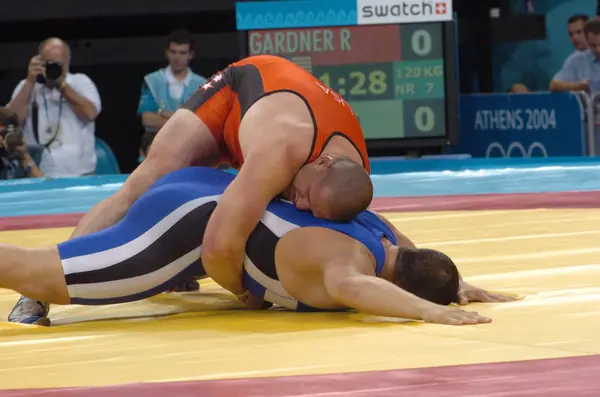 Rulon Gardner on the mat under a scoreboard reading “GARDNER R,” Athens 2004 Olympics, August 2004