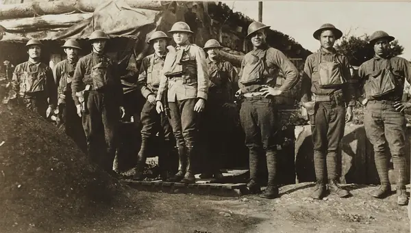 Chemical Warfare Service - Equipment - Miscellaneous - A line of American soldiers in a trench with gas mask ready in the bag hanging from their necks, France - NARA - 26424050