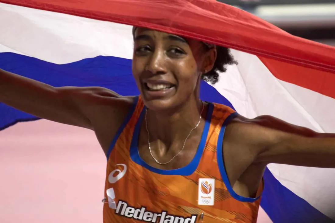 Sifan Hassan with the Dutch flag after her 1,500-meter world title, Doha, October 5, 2019