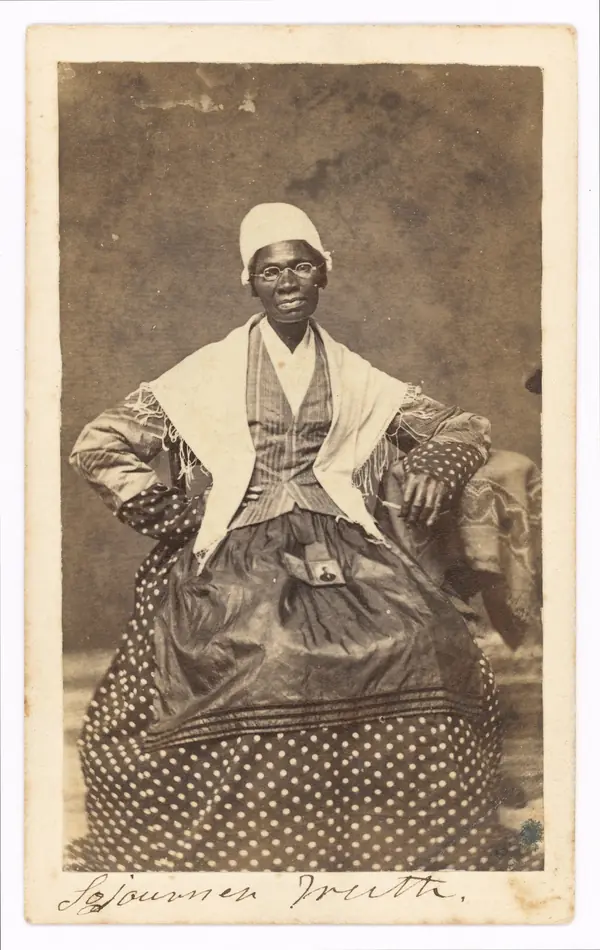 Sojourner Truth with a photograph of her grandson, James Caldwell of the 54th Massachusetts, on her lap, 1863 (not Peter)
