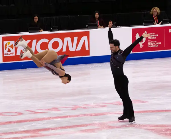 Deanna Stellato-Dudek in her assisted backflip with Maxime Deschamps, 2025 Skate Canada International, Saskatoon, October 31, 2025 (not Surya Bonaly)