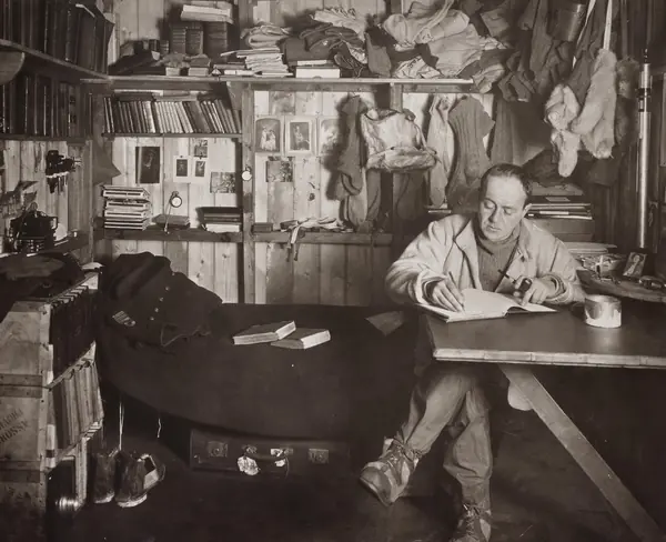 Captain Robert Falcon Scott writing his diary in the hut at Cape Evans, October 7, 1911