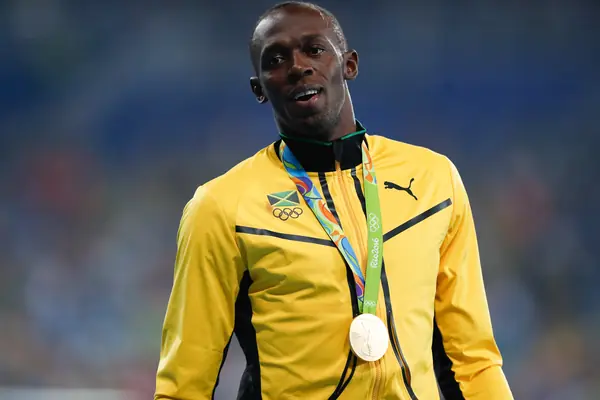 Usain Bolt with his 4 × 100 meters relay gold medal, Rio 2016