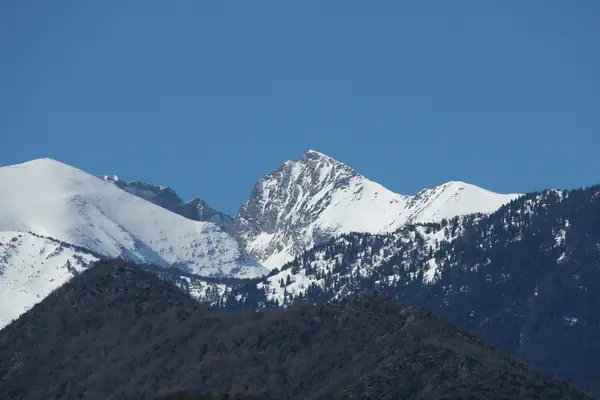 The Pic du Canigou in snow, from Mas Rouby, Pyrénées-Orientales, 2018 (not her exact route) (cropped)