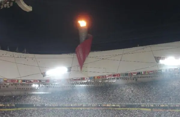 The Beijing National Stadium and the Olympic flame on the night of the pole vault final, August 18, 2008 (cropped)