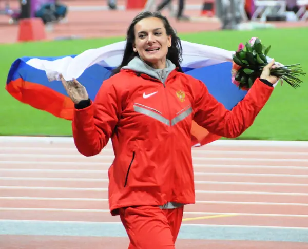 Yelena Isinbayeva with the flag after her bronze, London Olympics, August 6, 2012