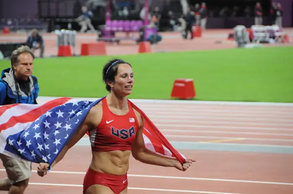 Jenn Suhr (Jenn Stuczynski in 2008) with the US flag after her gold, London Olympics, August 6, 2012 (not Beijing)